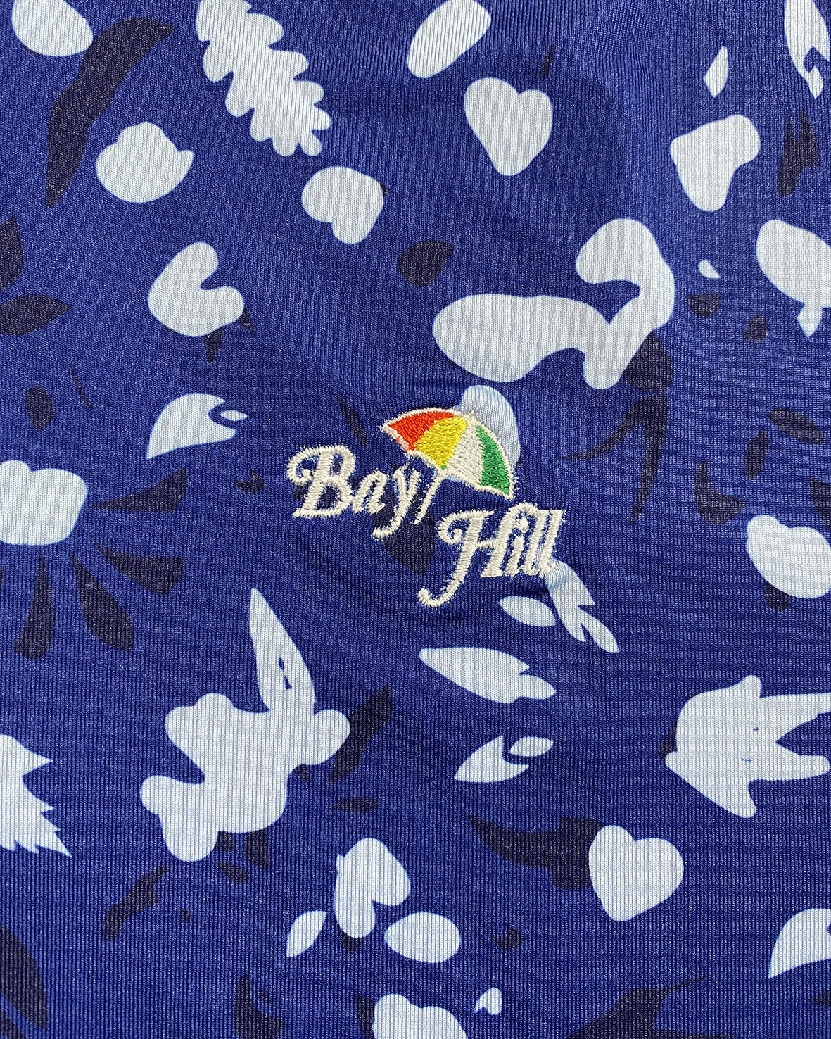Greyson Men’s Wolf Forest Golf Polo Shirt, embroidered Close up